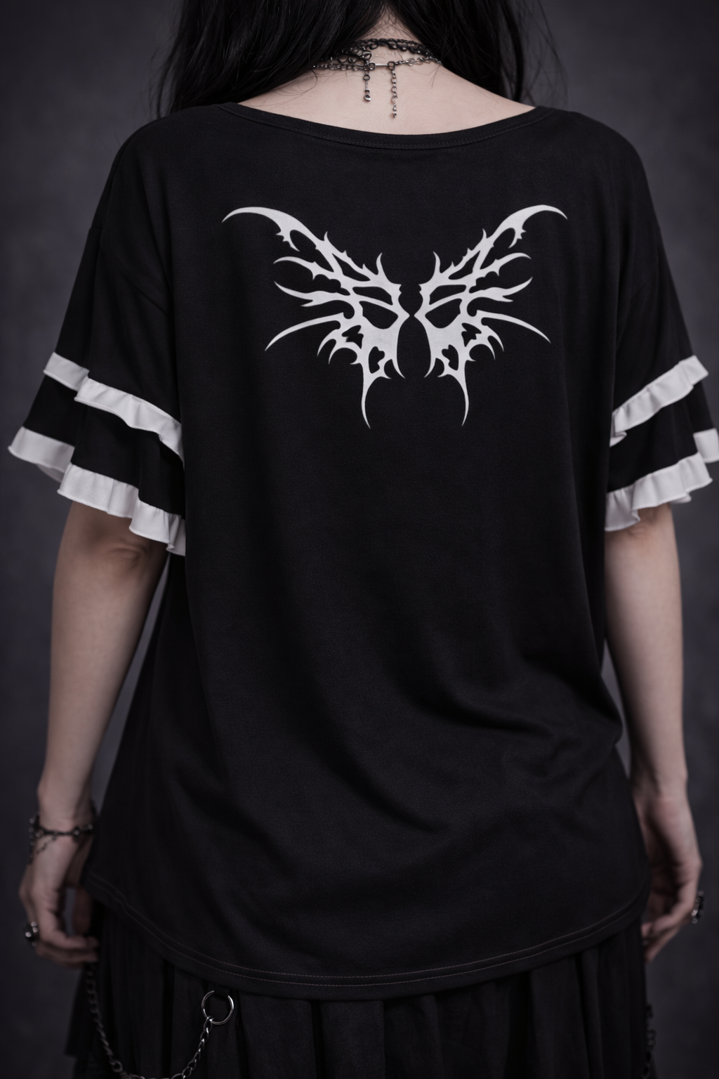 Women in a Gothic Lolita blouse with ruffles